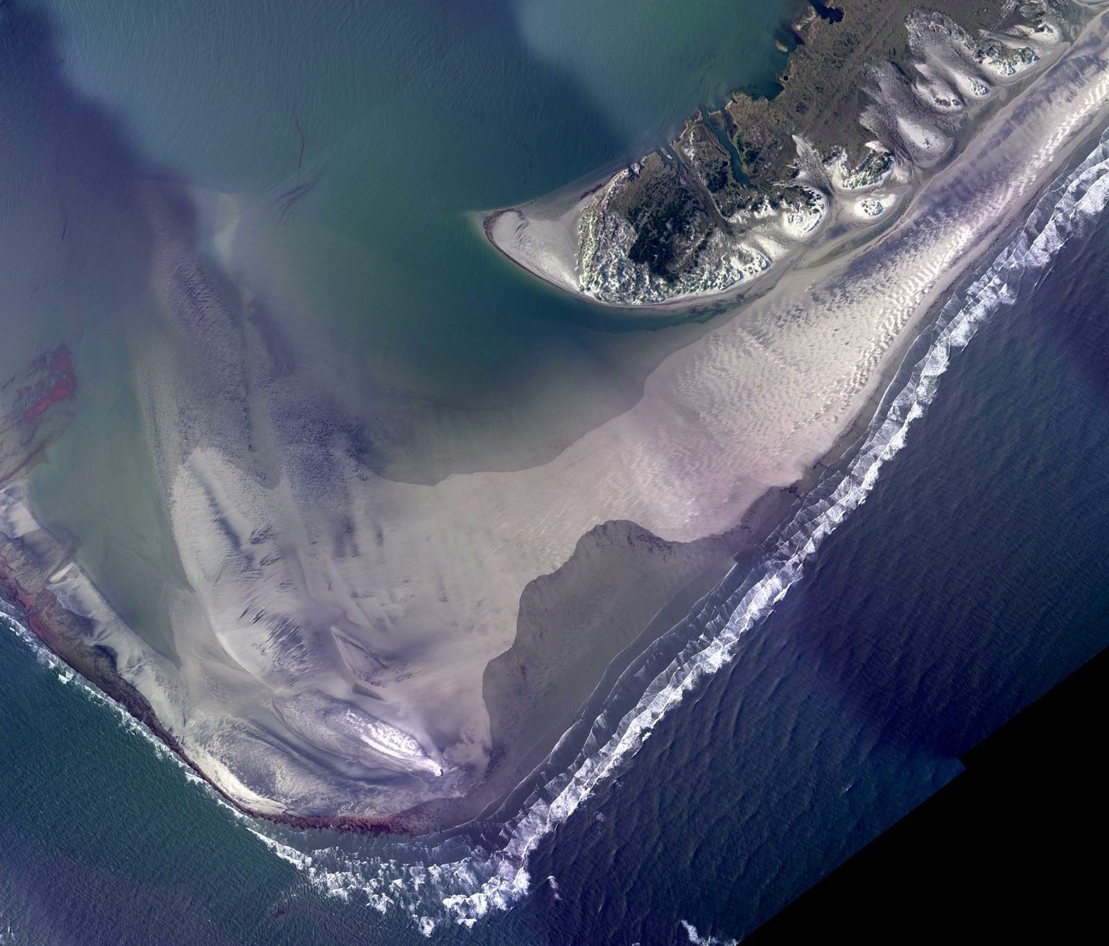 Aerial photograph of the south end of Ocracoke Island and the sand shoals of Ocracoke Inlet, taken by NOAA on 28 August 2011 after Hurricane Irene